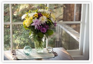 Flower bouquet near window